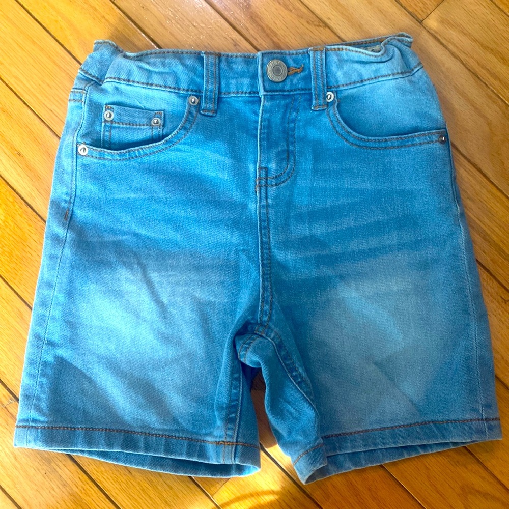 Stretchy size 8 light blue denim shorts with adjustable waist band.